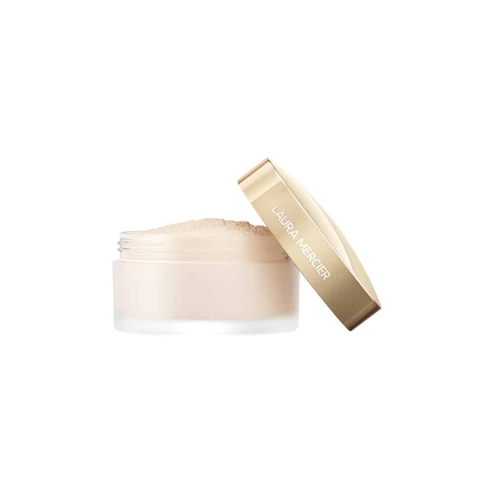 Translucent loose setting powder jar with beige-gold cap and pale powder