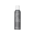 Gray dry shampoo bottle with white cap, front label visible