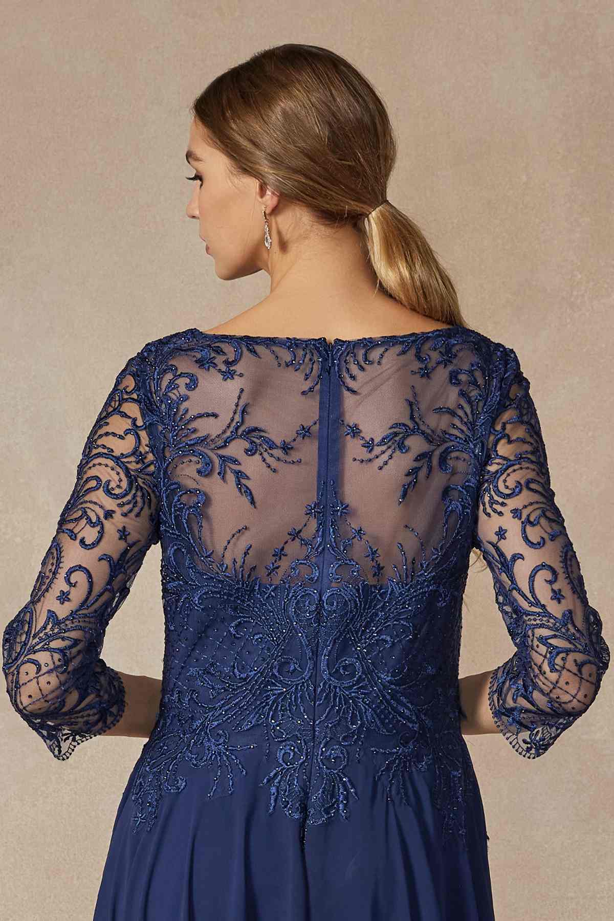 Navy long A-line dress back view with sheer lace sleeves and intricate appliqued detail