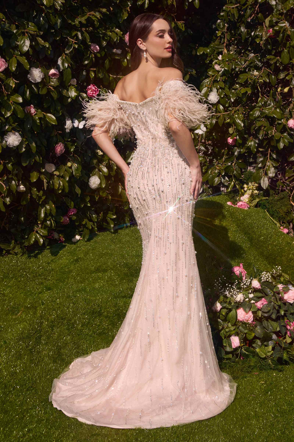 Rose champagne strapless pearl gown with feather sleeves and long train