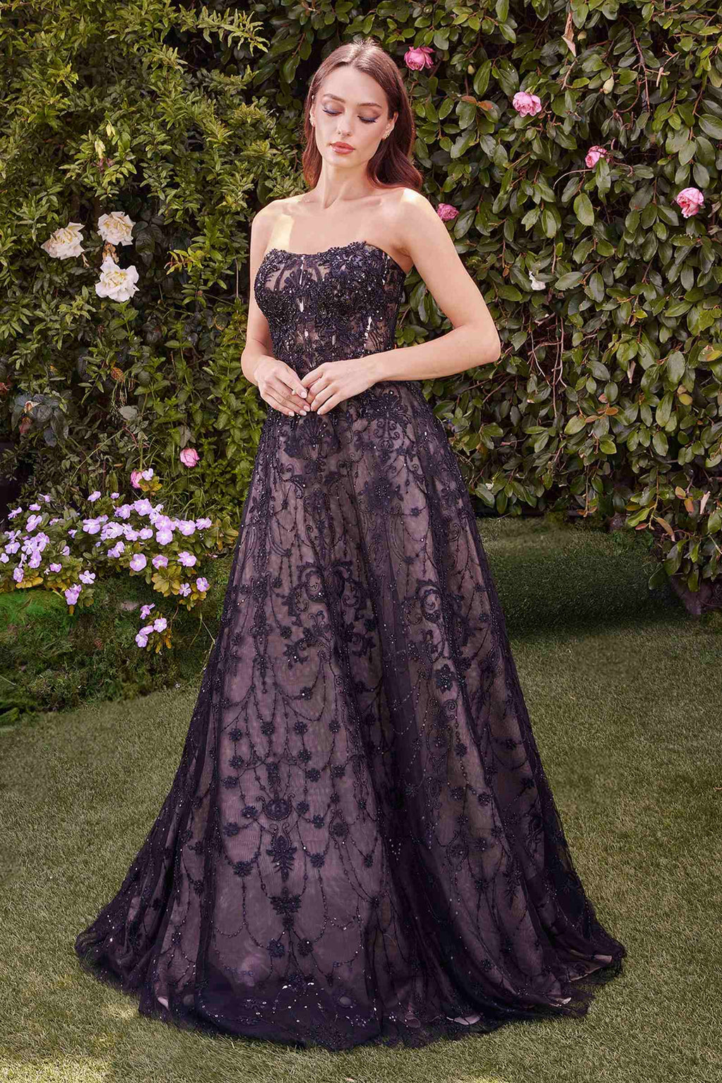Dark plum strapless lace ball gown with fitted bodice and full skirt