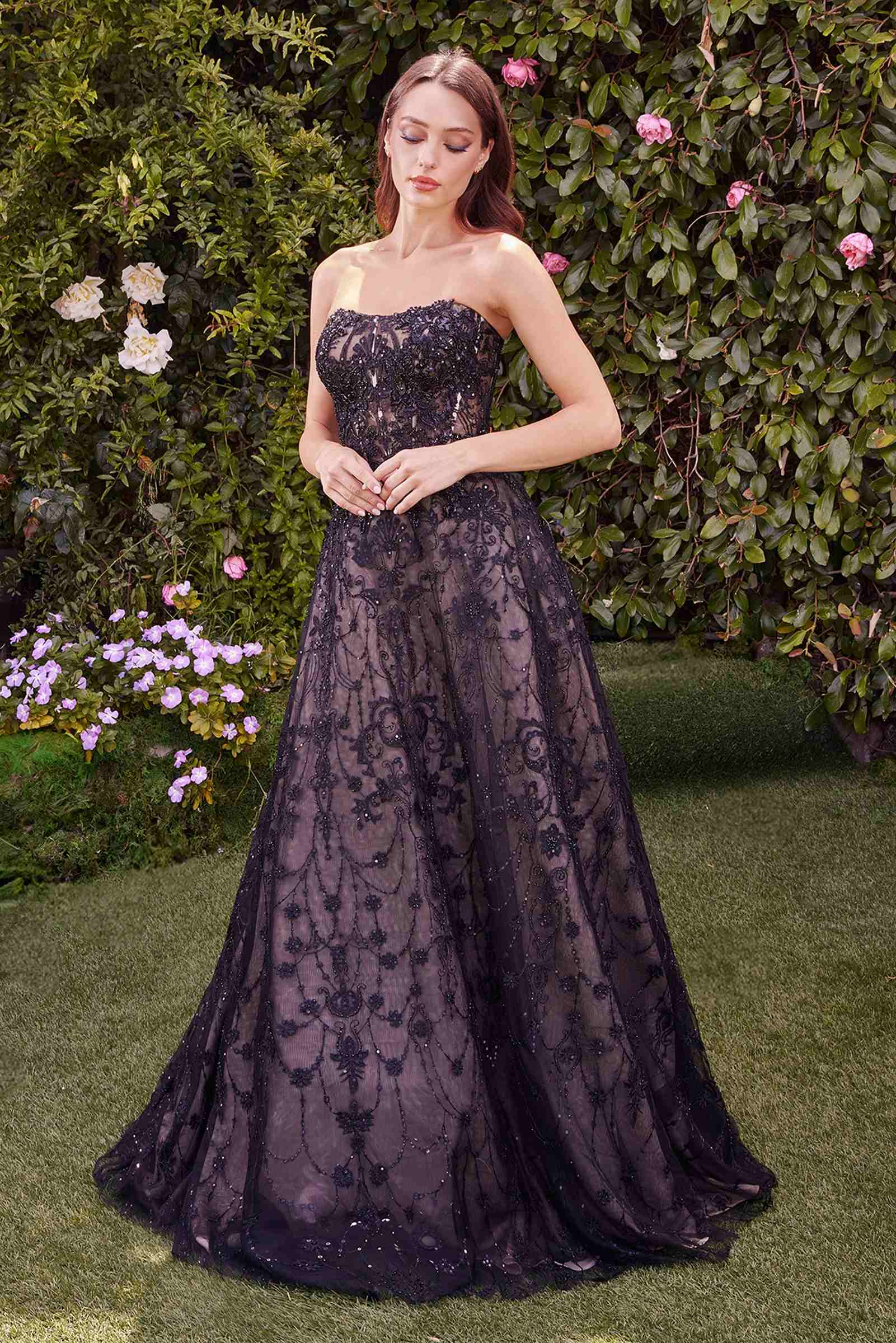 Dark plum strapless lace ball gown with fitted bodice and full skirt