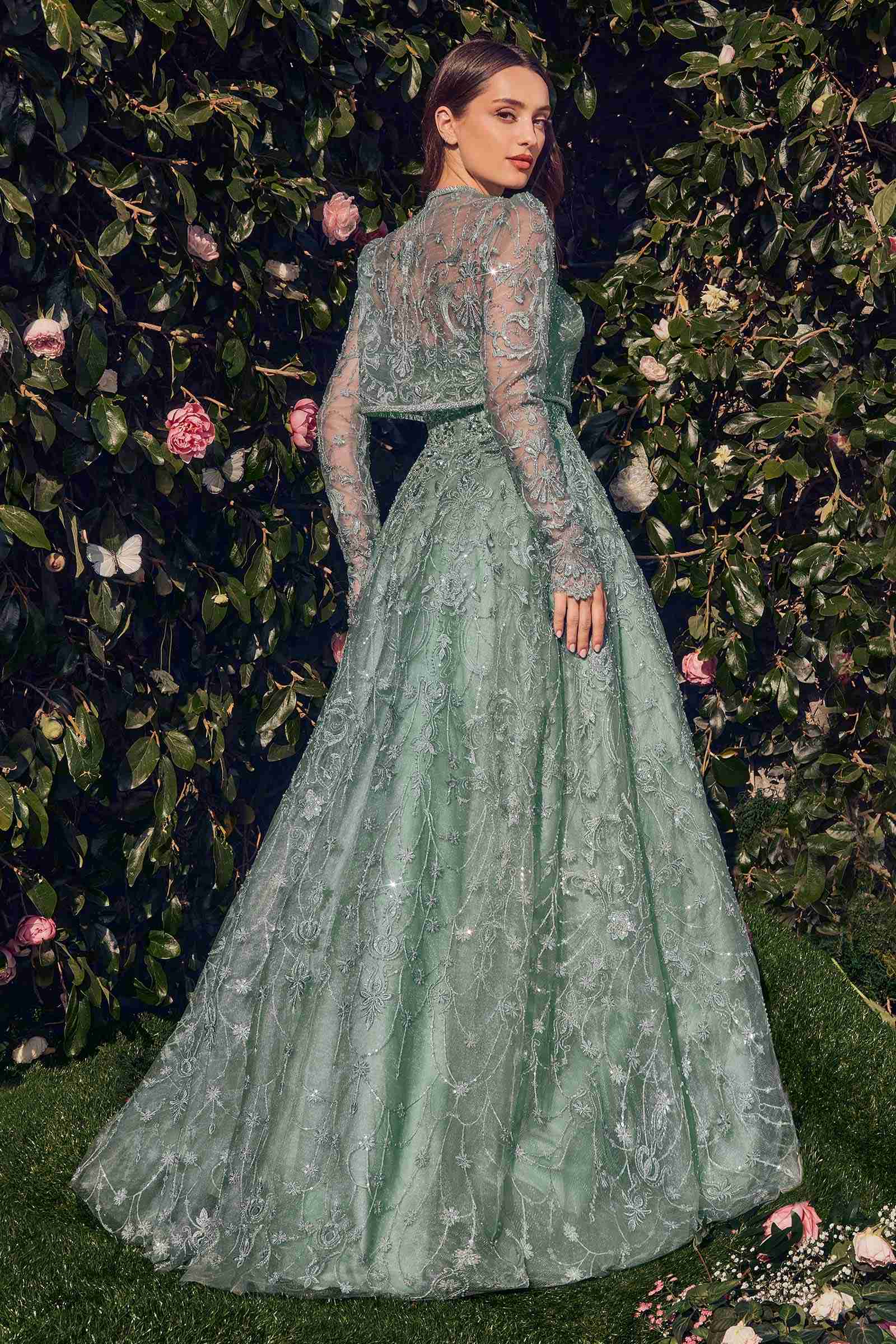 Teal lace ball gown with long sleeves and full pleated skirt, back view