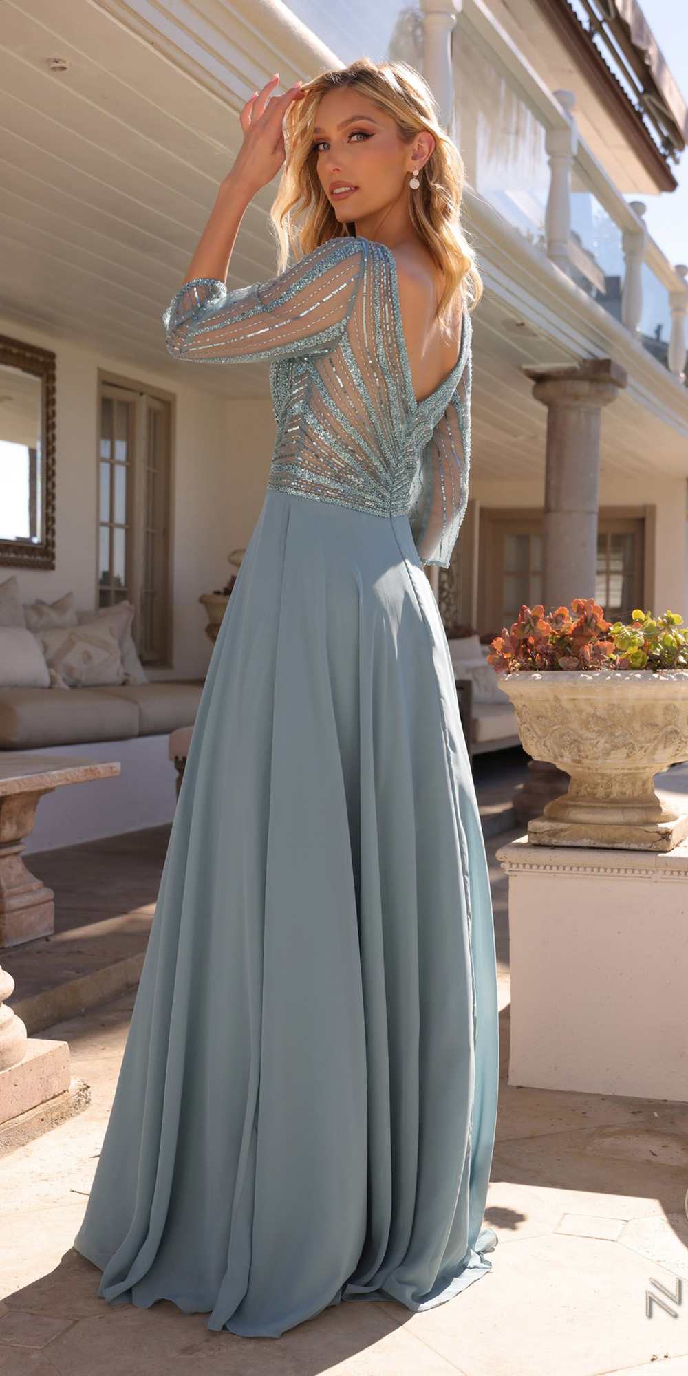 Sea blue A-line gown with embellished V-neck bodice and 3/4 sleeves, full skirt