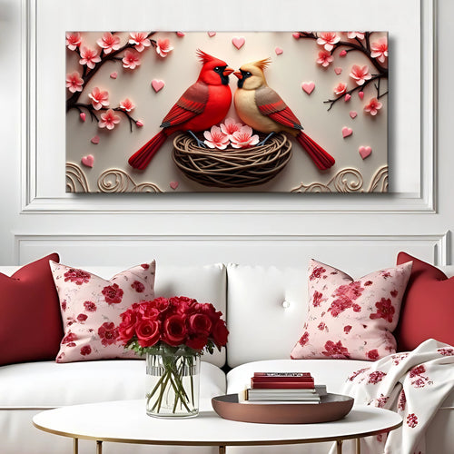 3D cardinal wall art in a white frame above a sofa with red floral pillows