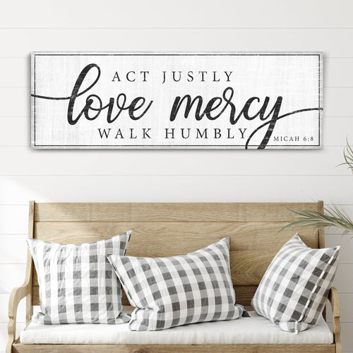 Wall canvas sign with black text: Act Justly, Love Mercy, Walk Humbly, Micah 6:8