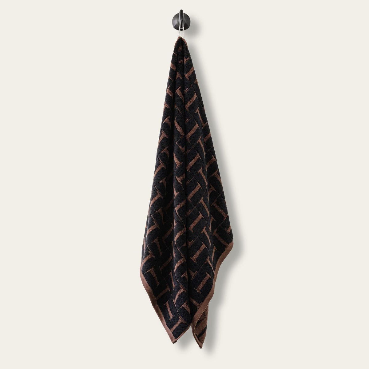 Hanging cotton towel, dark tobacco and black geometric pattern