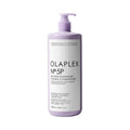 Olaplex blonde enhancer toning bottle with pump dispenser and light purple label