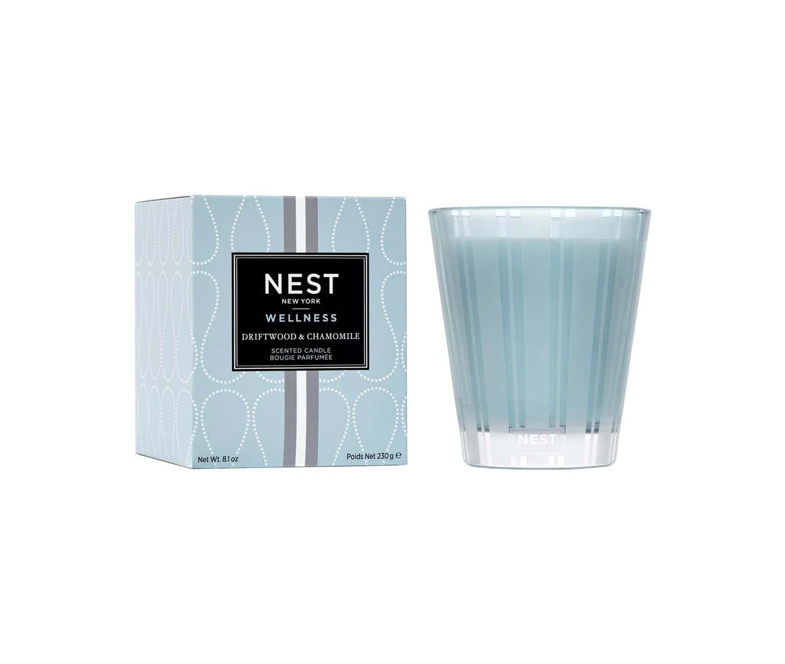 Scented candle set with NEST Wellness box and pale blue glass jar, front view
