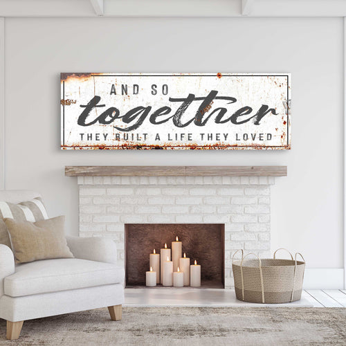 Distressed wall sign with black script 'together' and 'THEY BUILT A LIFE THEY LOVED'