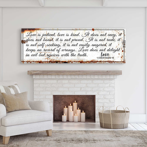 Rustic wall sign with brown distressed frame and white script verse on dark background.