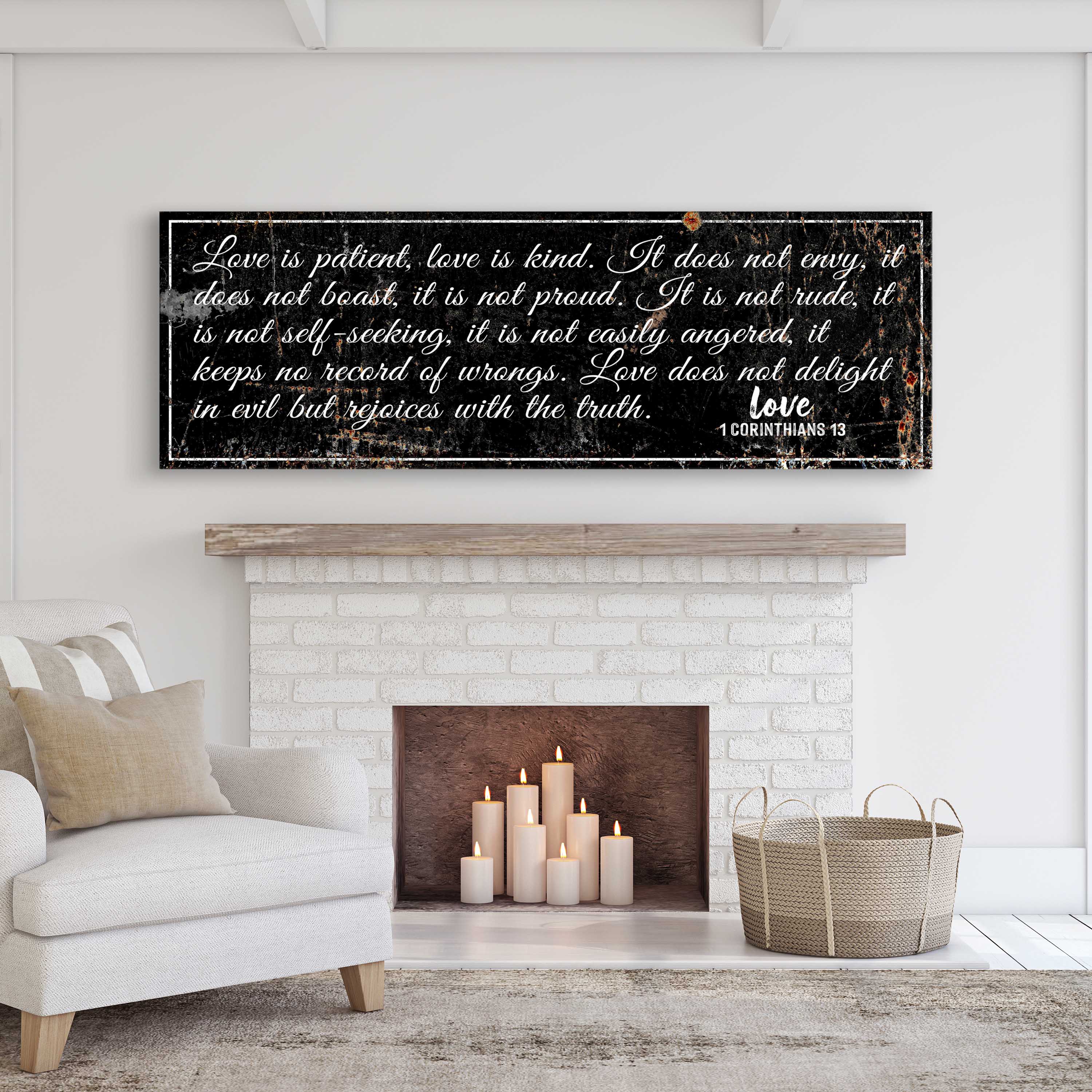 Chalkboard-style wall sign with white script verse 'Love is patient, love is kind.'