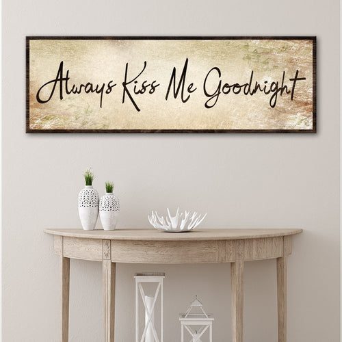 Canvas wall sign reading “Always Kiss Me Goodnight” on a beige distressed background