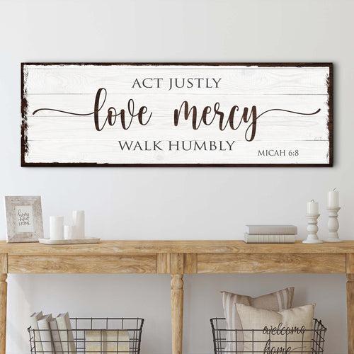 Wood wall sign reading “Act Justly,” “Love Mercy,” “Walk Humbly,” “Micah 6:8”