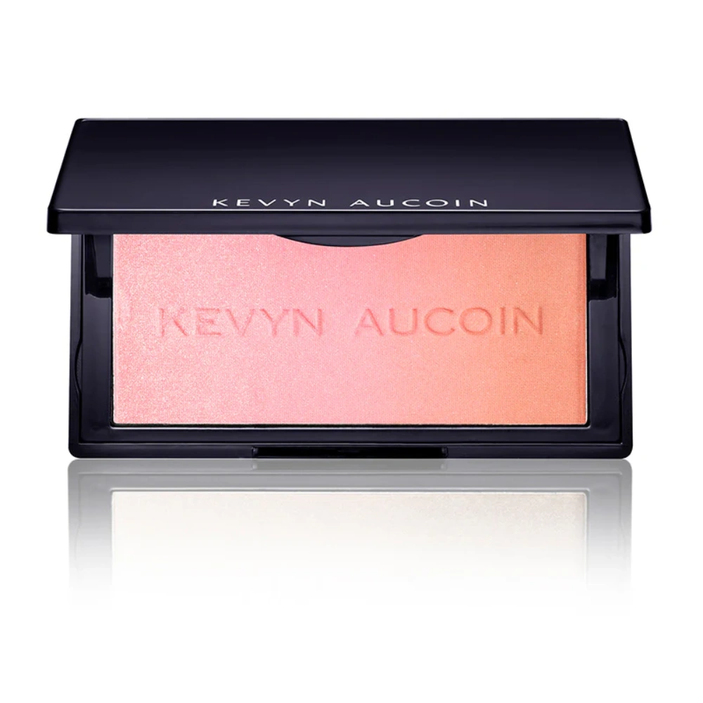 Shimmer blush compact with light peach powder pan in black case