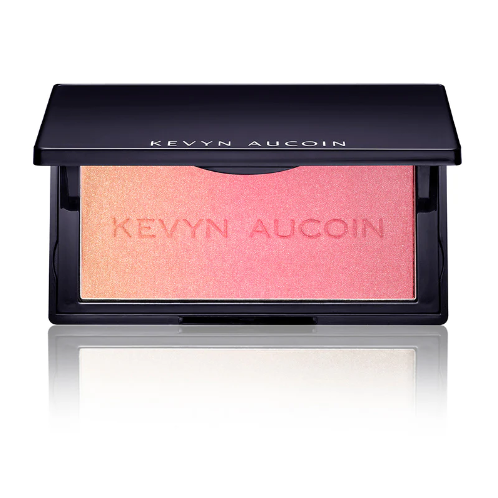 Shimmer blush compact with peach-orange powder pan in black case