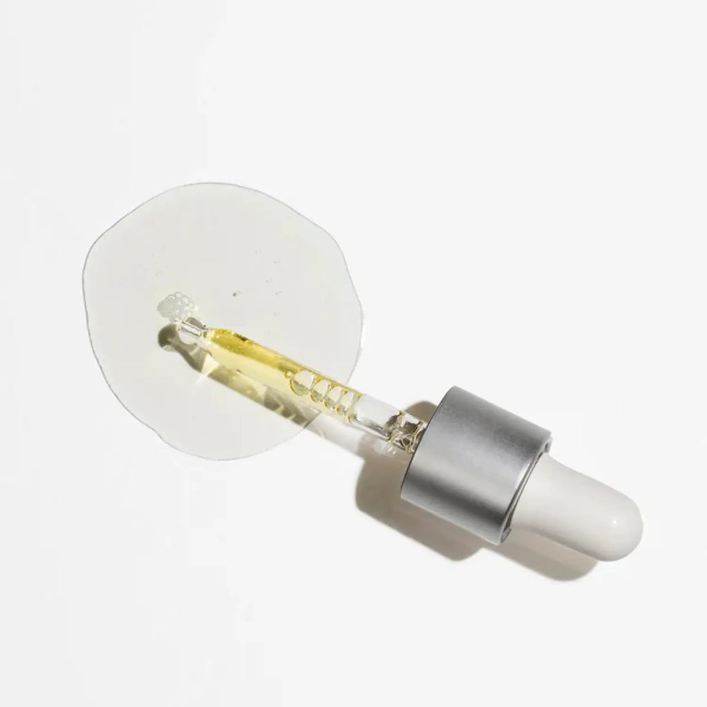 Antioxidant serum dropper with clear/yellow serum liquid and silver metal tip