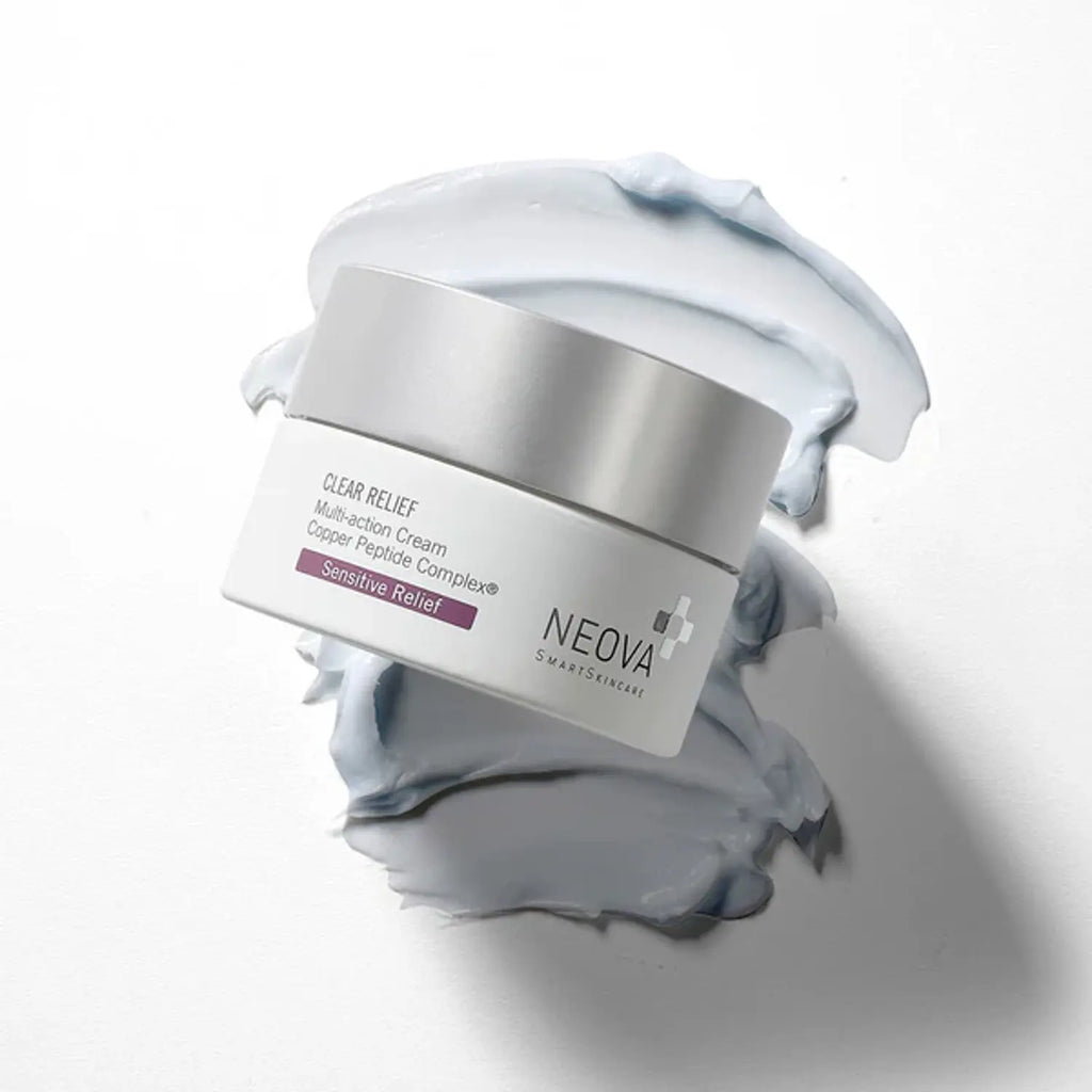 Neova Clear Relief cream jar with silver lid, surrounded by light blue cream smear