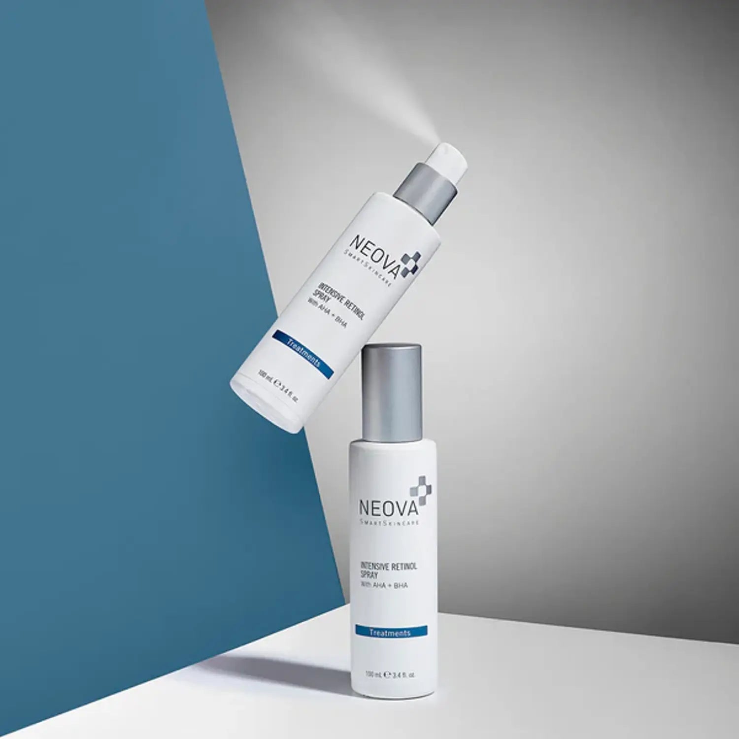 Neova retinol spray bottles, one upright and one lying, silver caps