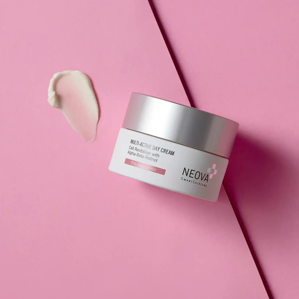Neova Multi-Active Day Cream jar with silver lid on pink surface