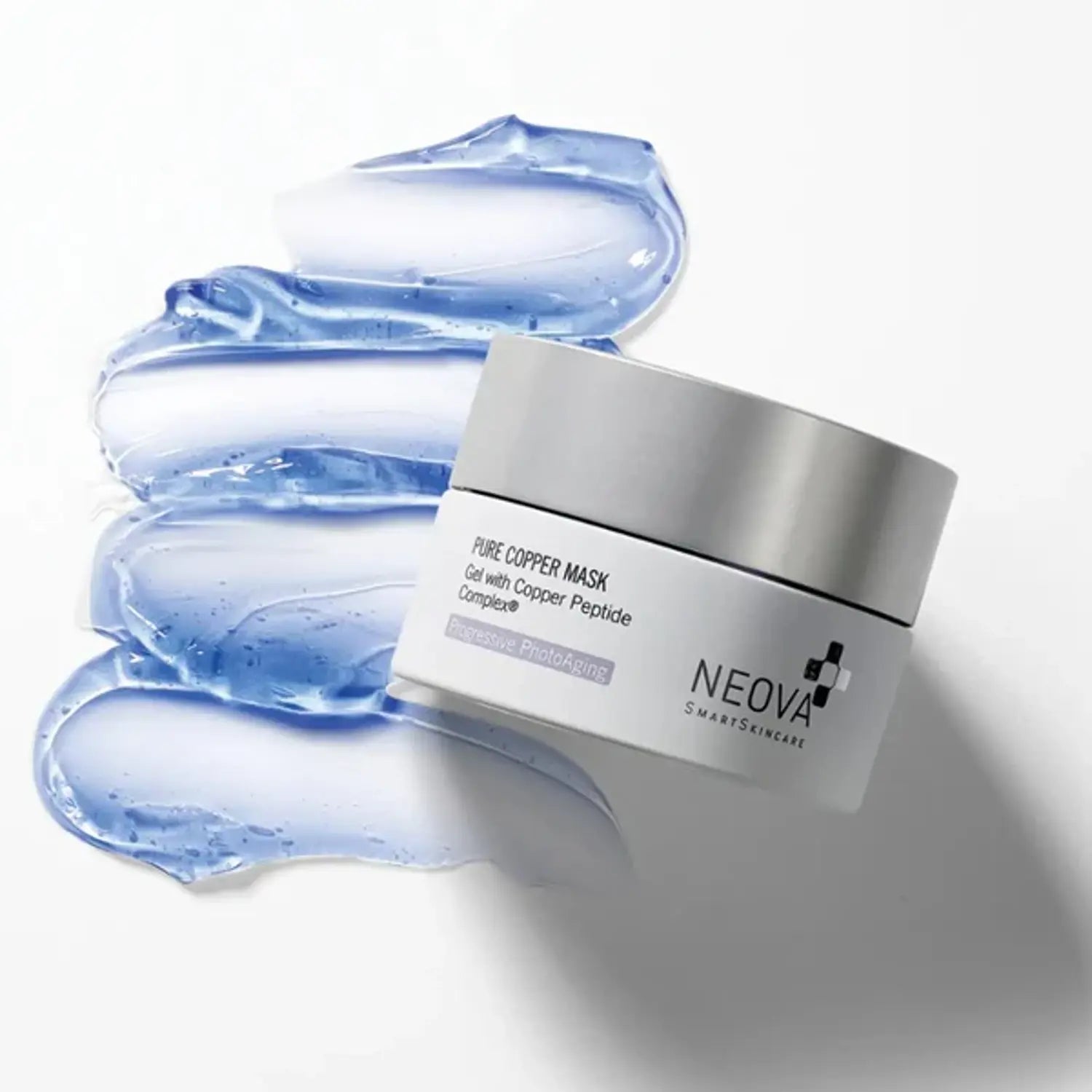 Pure copper mask jar with silver lid over blue gel smear
