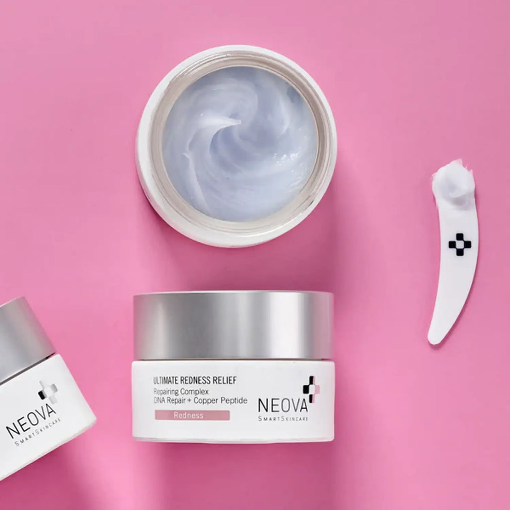 Neova redness relief moisturizer jar with small bottle and white spatula.