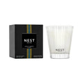 Ribbed white glass candle with NEST label, shown with matching box