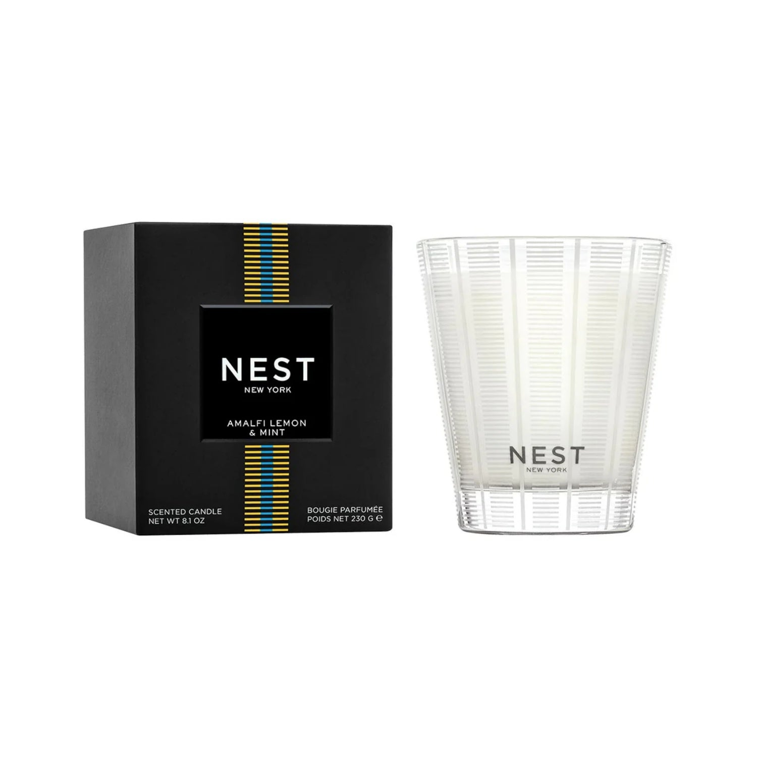 Ribbed white glass candle with NEST label, shown with matching box