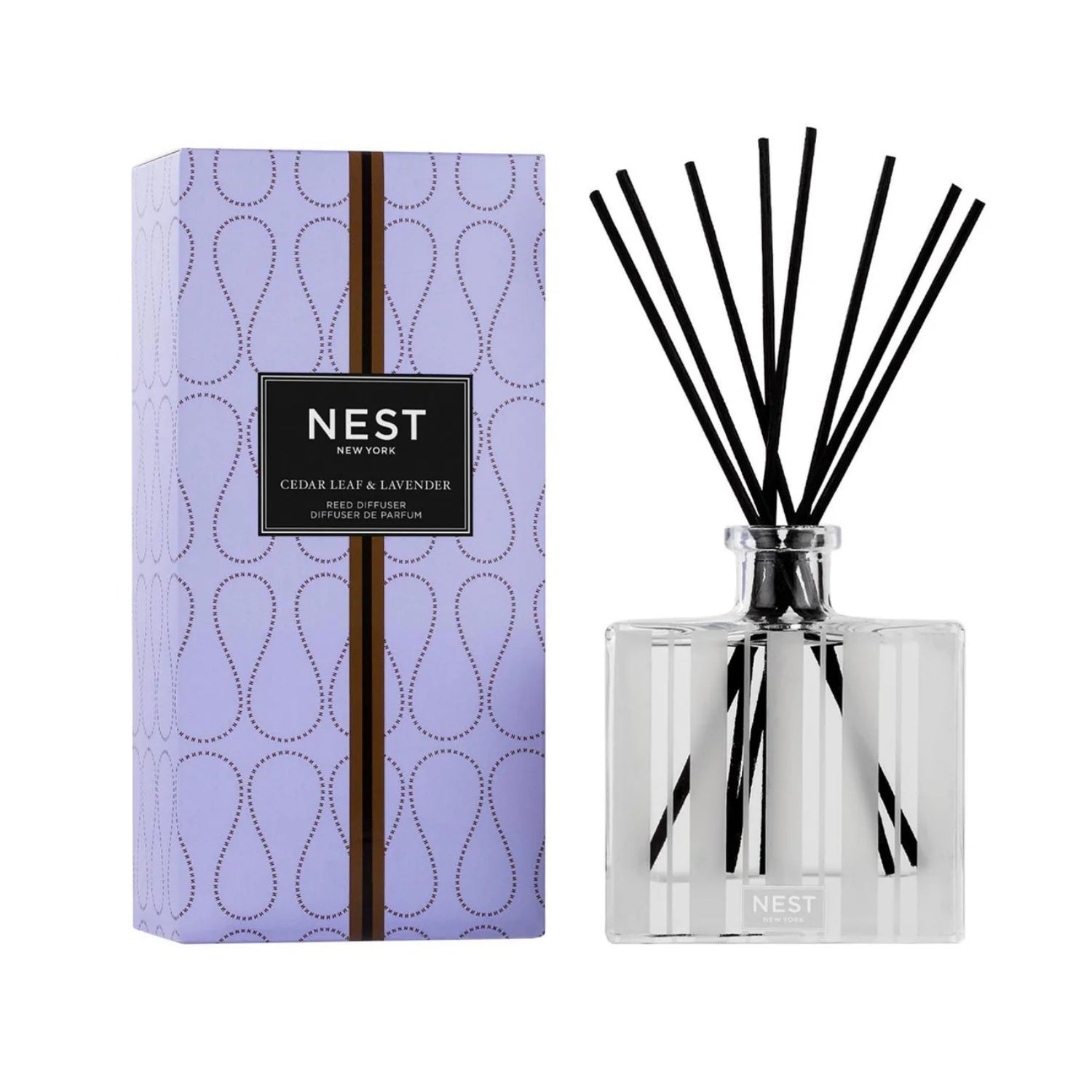Reed diffuser with clear glass, black reeds, silver top; lavender-cedar label