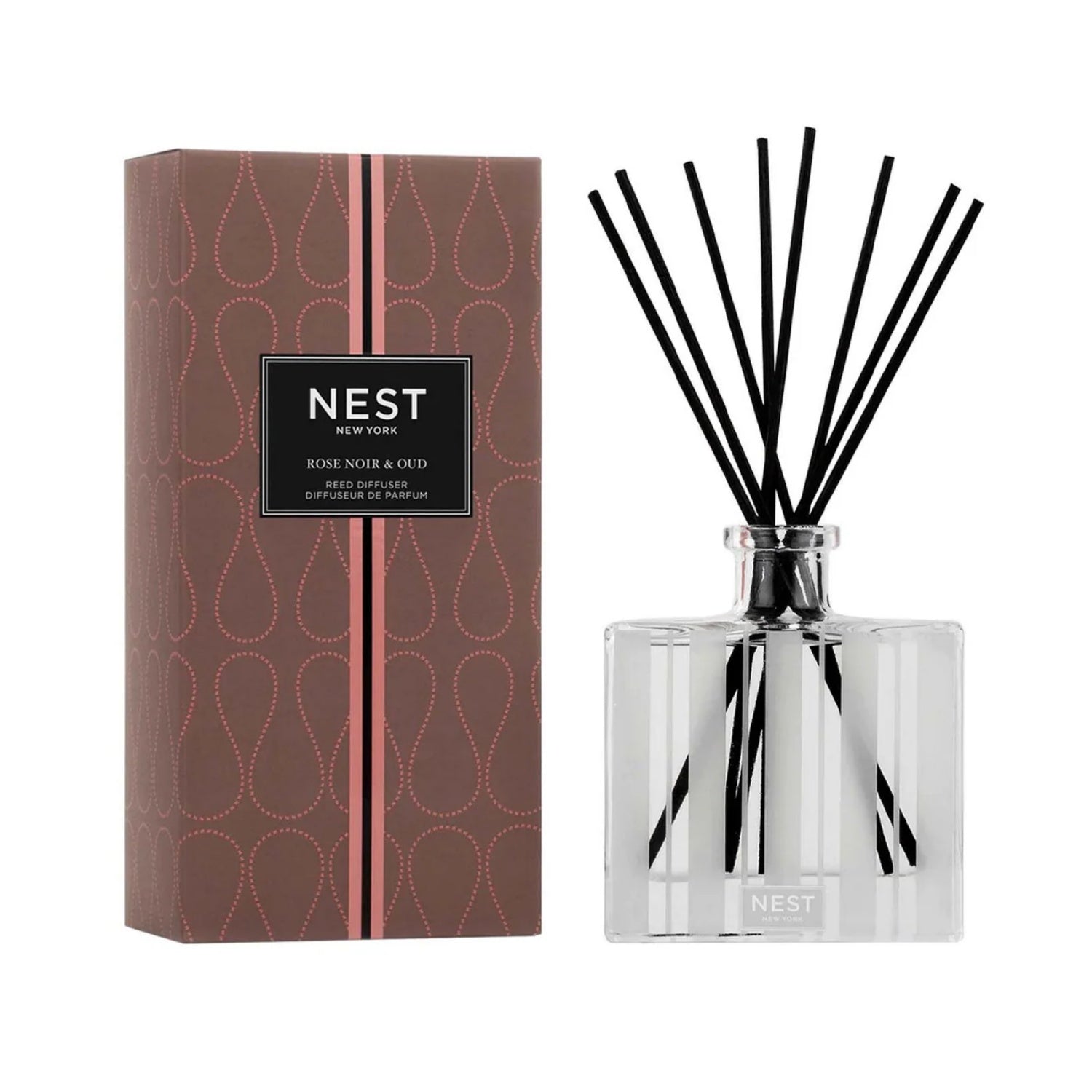 Reed diffuser set with clear glass bottle, dark reeds, and decorative gift box