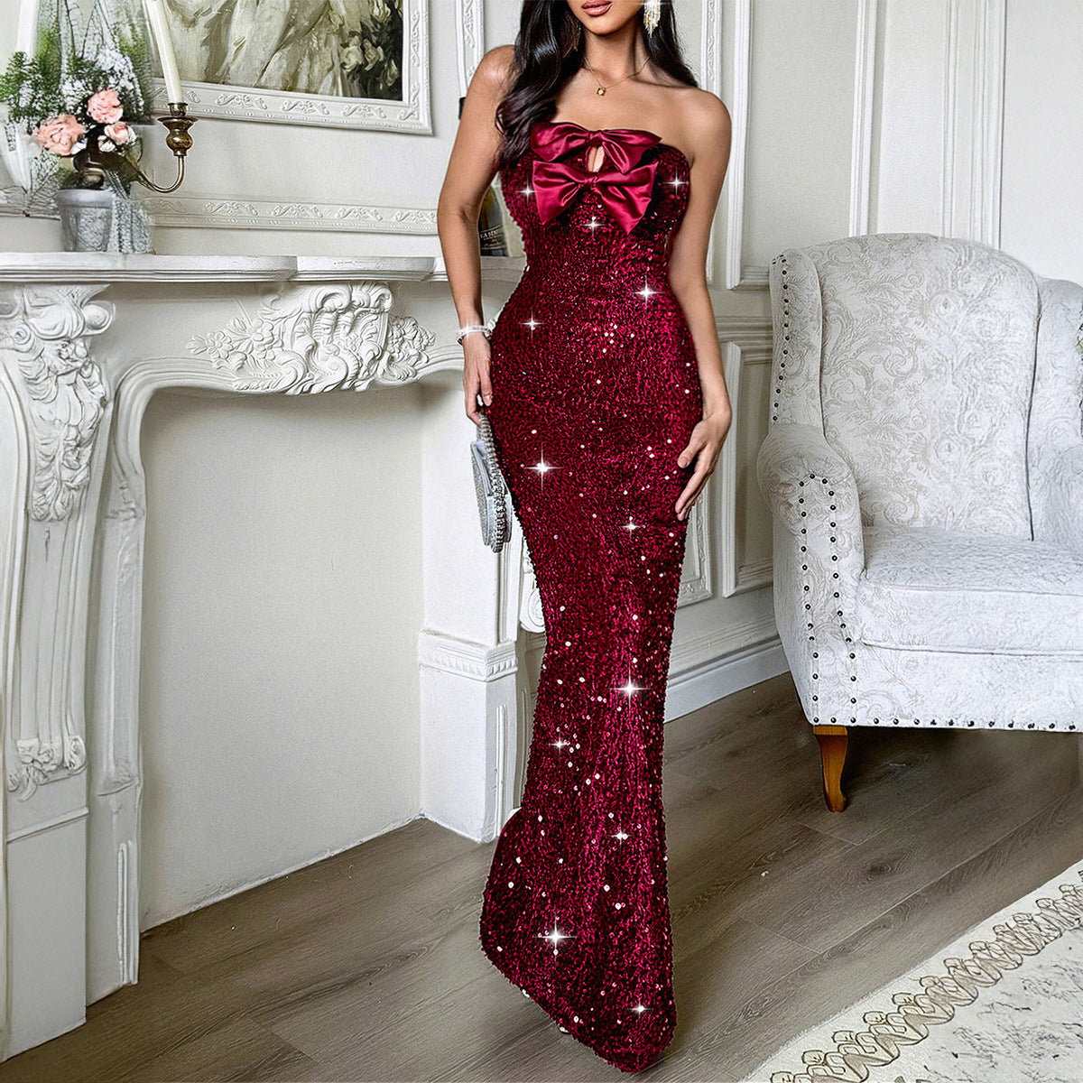 Women's burgundy red sequin strapless maxi dress with satin bow at bust