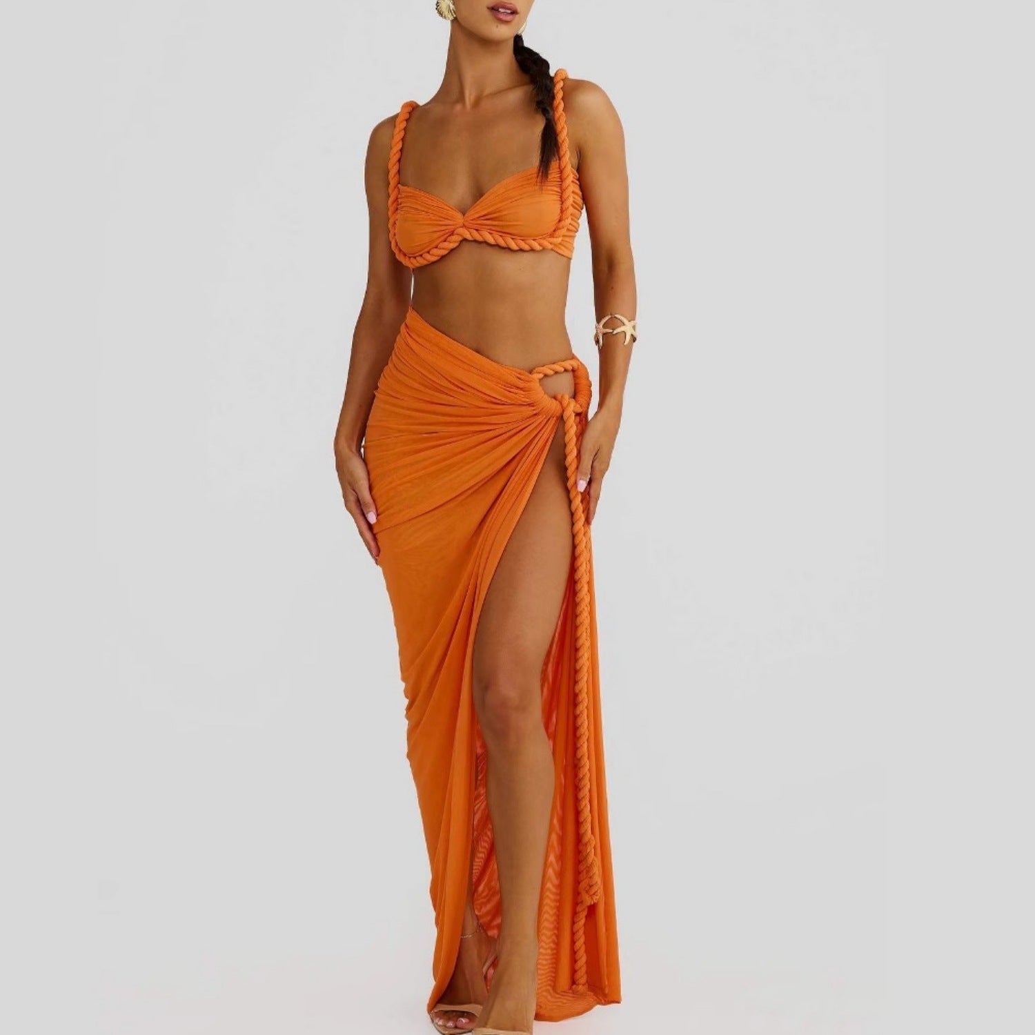 Orange halter bikini top and draped high-slit wrap skirt swimsuit set with tie strap