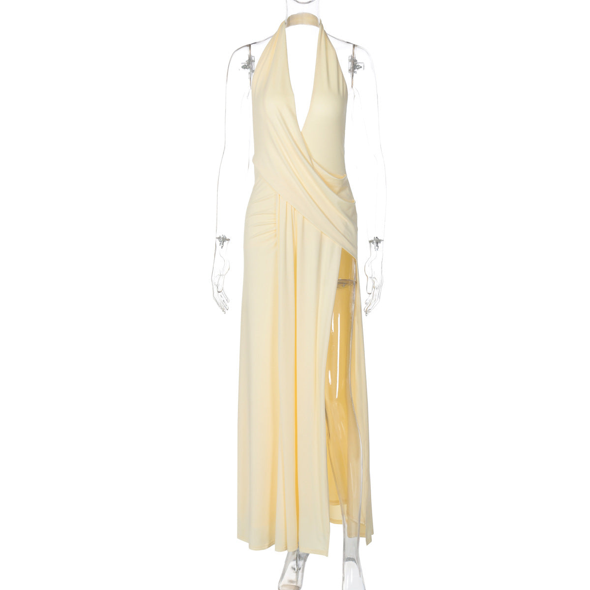 Cream halter V-neck dress with draped pleats and sheer layered skirt.