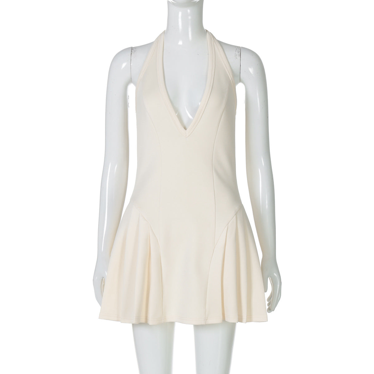 Apricot halter mini dress with deep V neckline and pleated flared skirt
