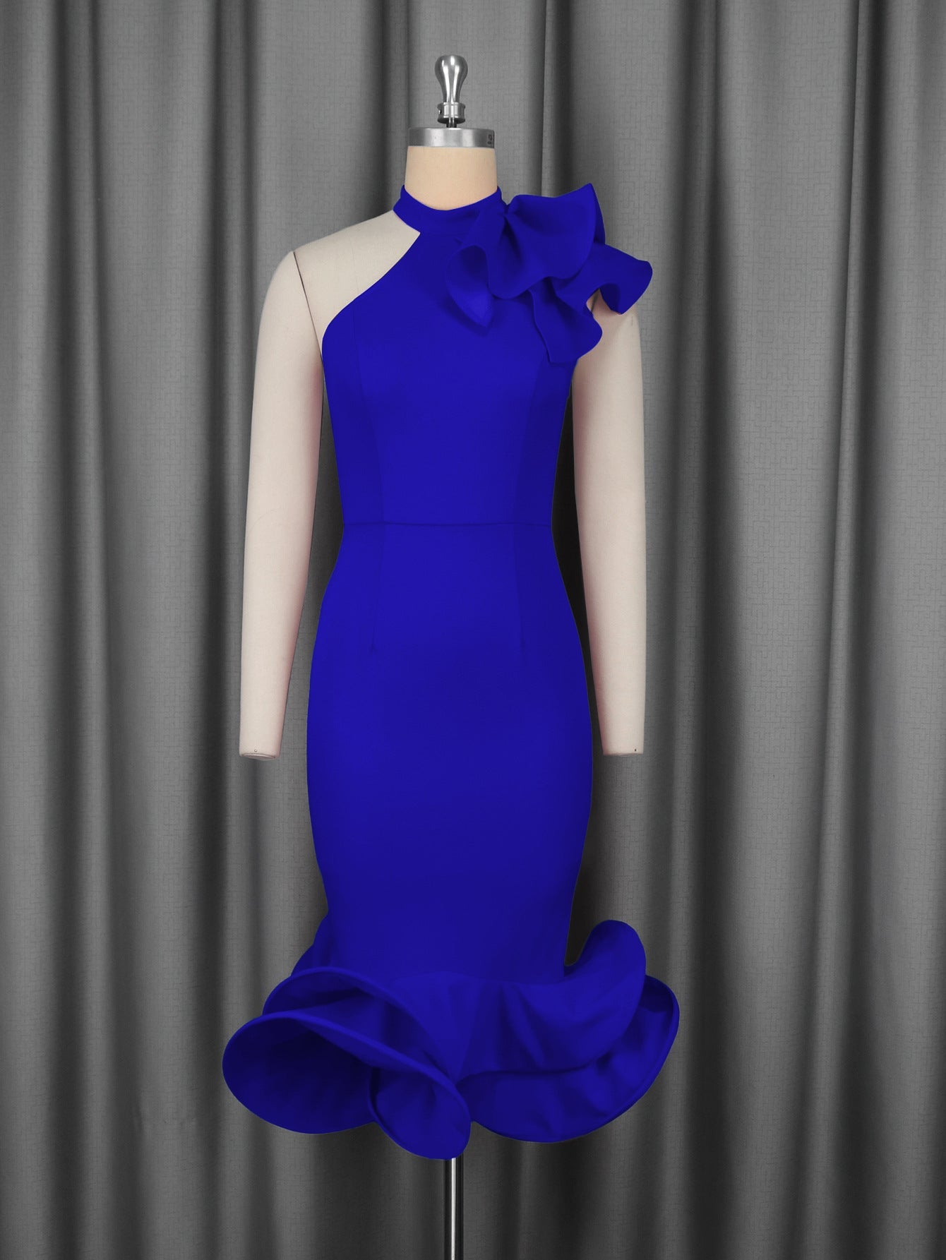 Blue fitted cocktail dress on mannequin with ruffled collar and layered flared hem
