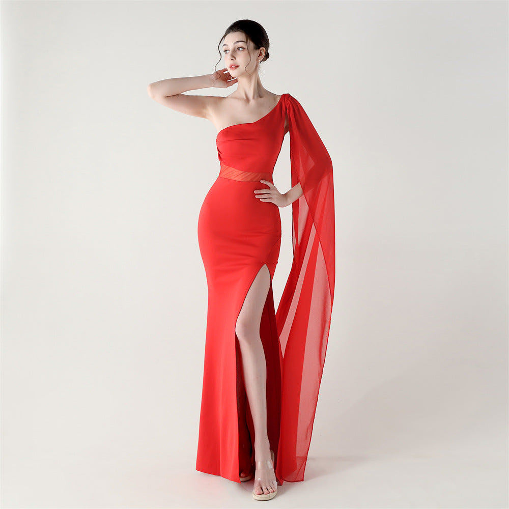 Single-shoulder satin slim cocktail dress with thigh slit and sheer mesh drape, bright red.