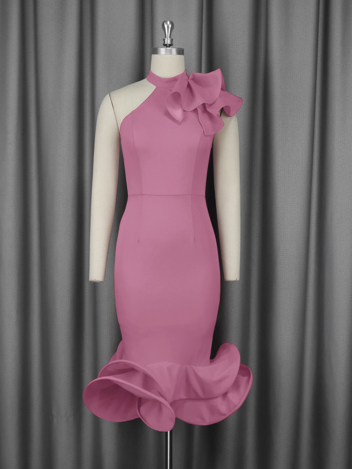 Pink fitted cocktail dress on mannequin with ruffled collar and layered flared hem