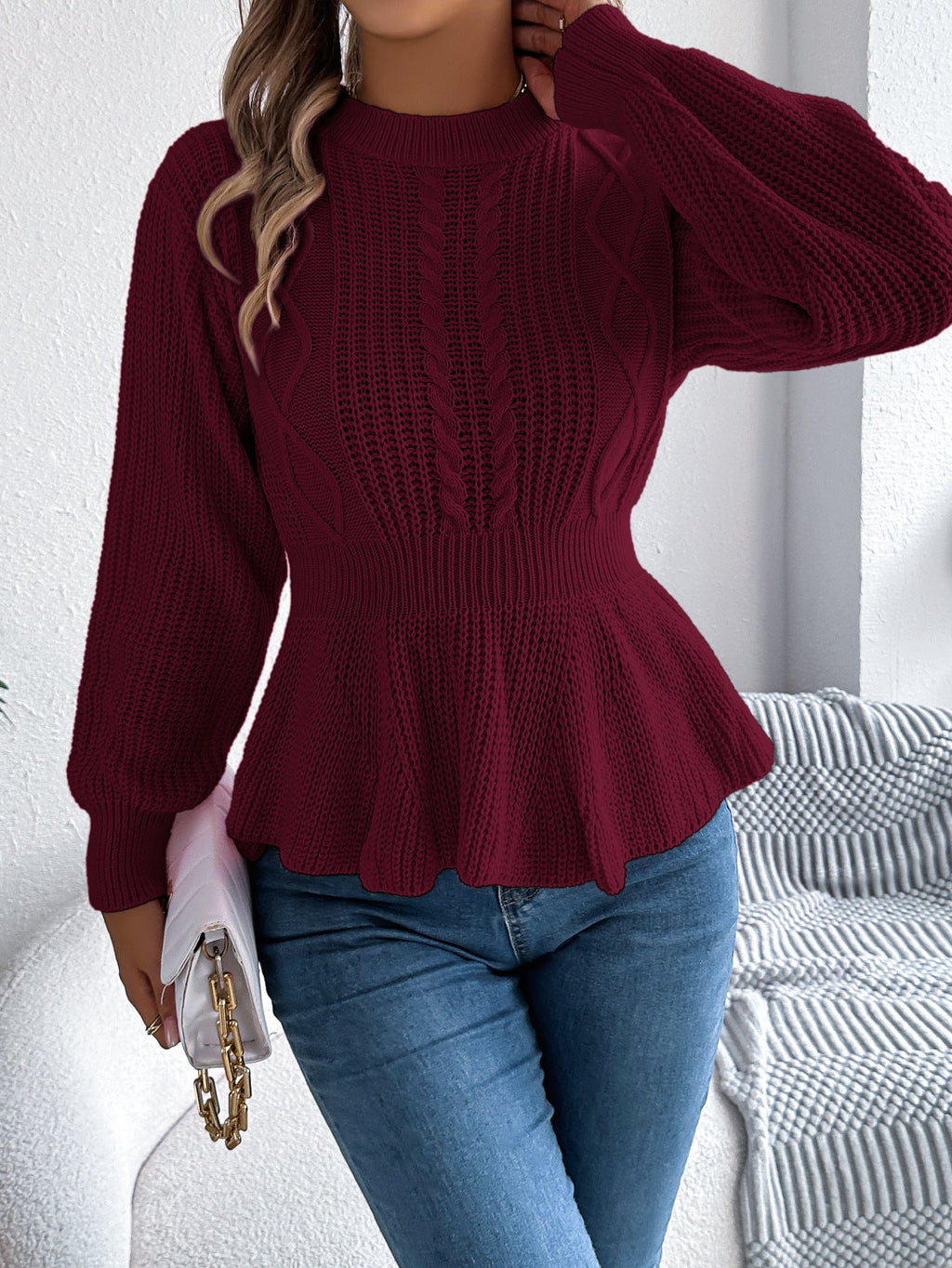 Burgundy long-sleeve knit peplum sweater with twist stitch yoke and ruffle waist trim