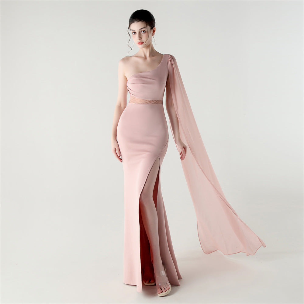 Single-shoulder satin slim cocktail dress with thigh slit and sheer mesh drape, blush pink.