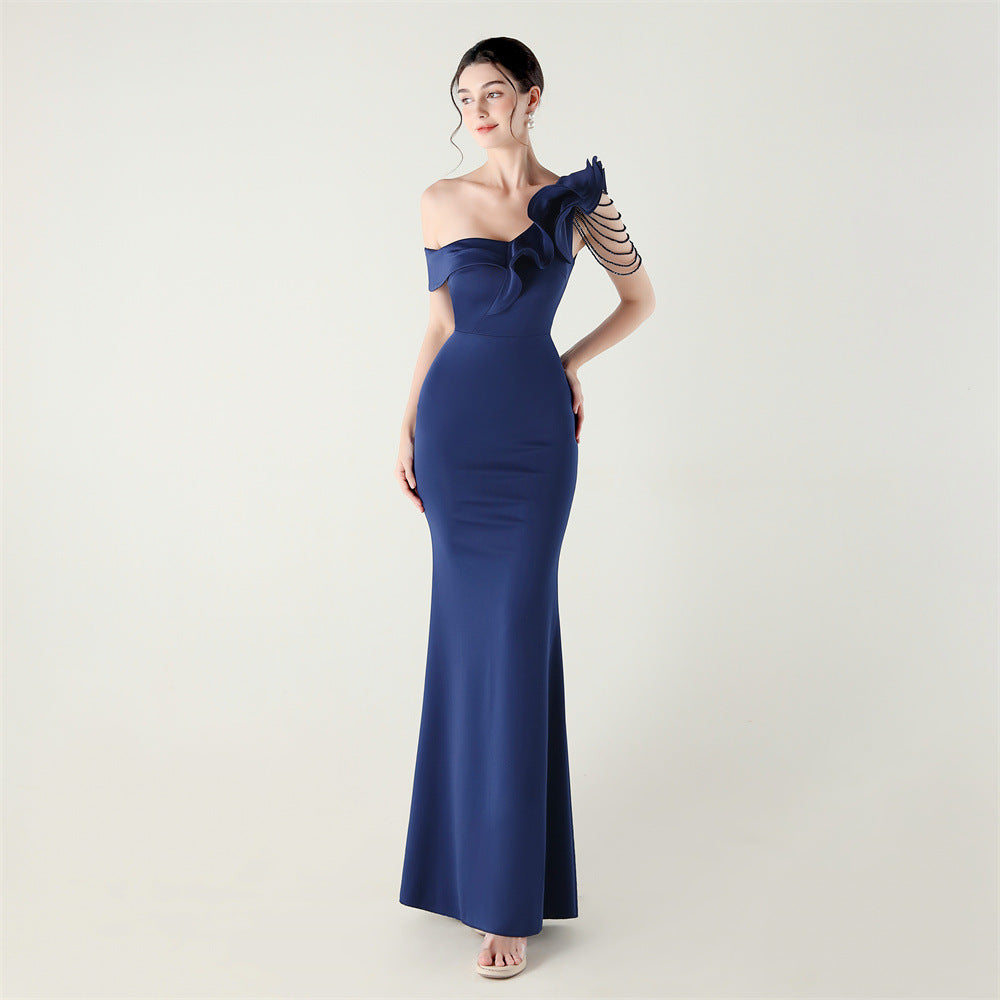 Navy one-shoulder satin evening dress with ruffled bodice and fitted mermaid skirt