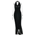 Black halter maxi dress with deep V neckline, pleated ruffles, and long slit