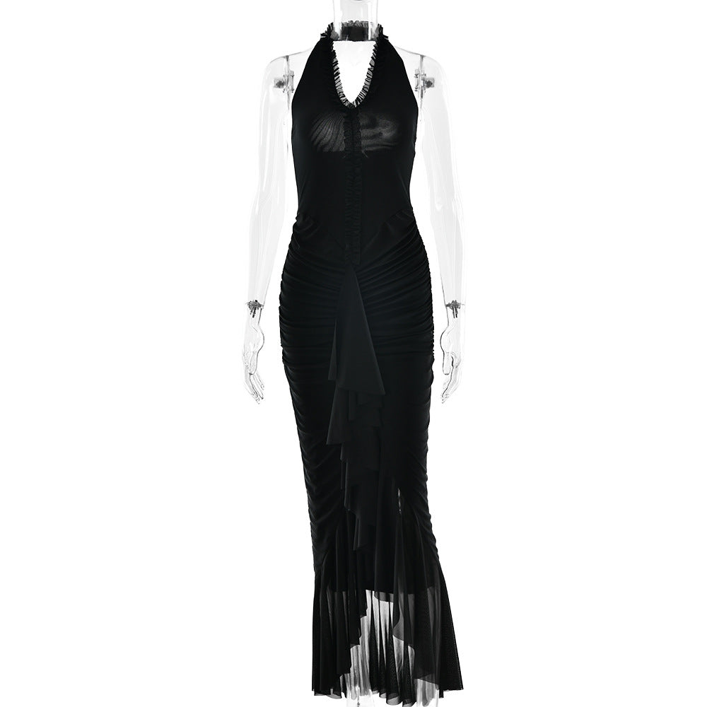 Black halter maxi dress with deep V neckline, pleated ruffles, and long slit