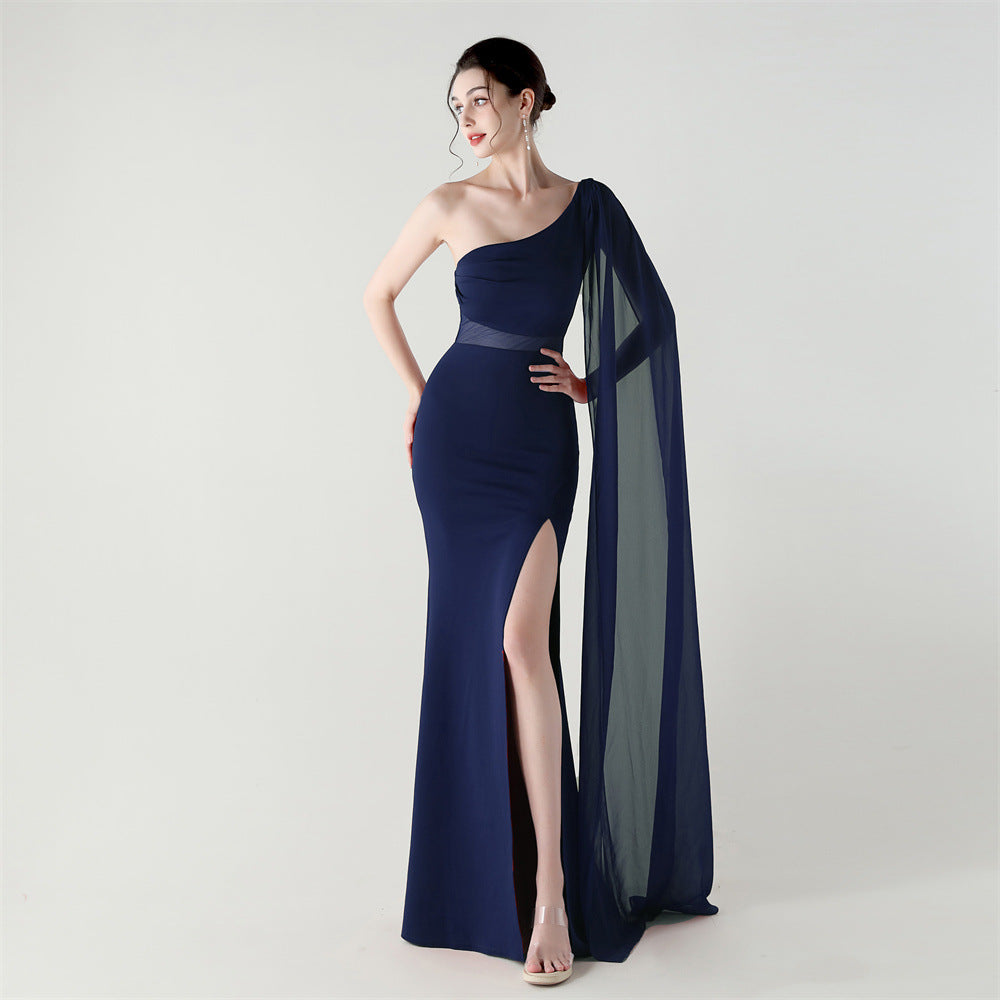 Single-shoulder satin slim cocktail dress with thigh slit and sheer mesh drape, navy blue.