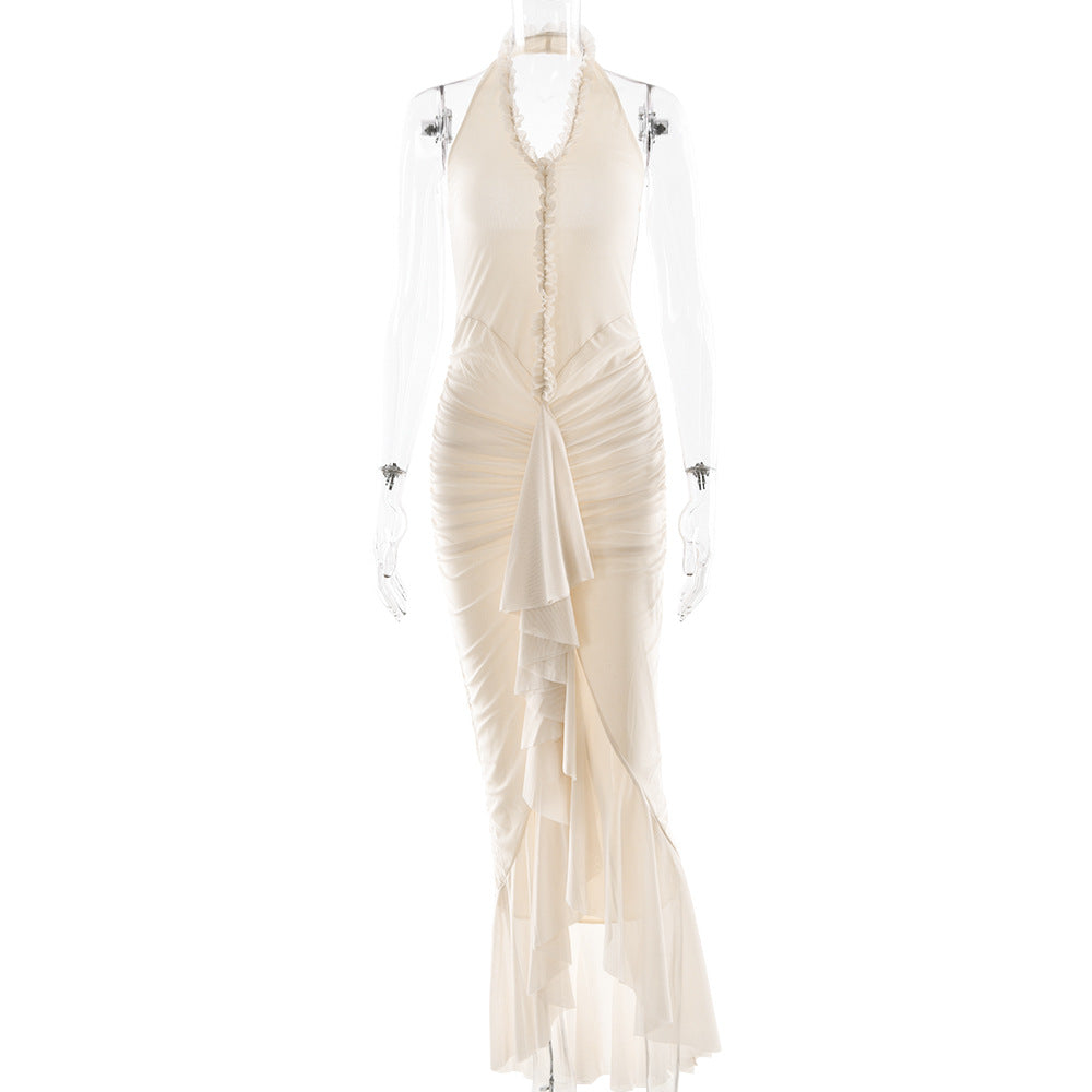 Cream halter maxi dress with deep V neckline, ruffled pleats, and long slit