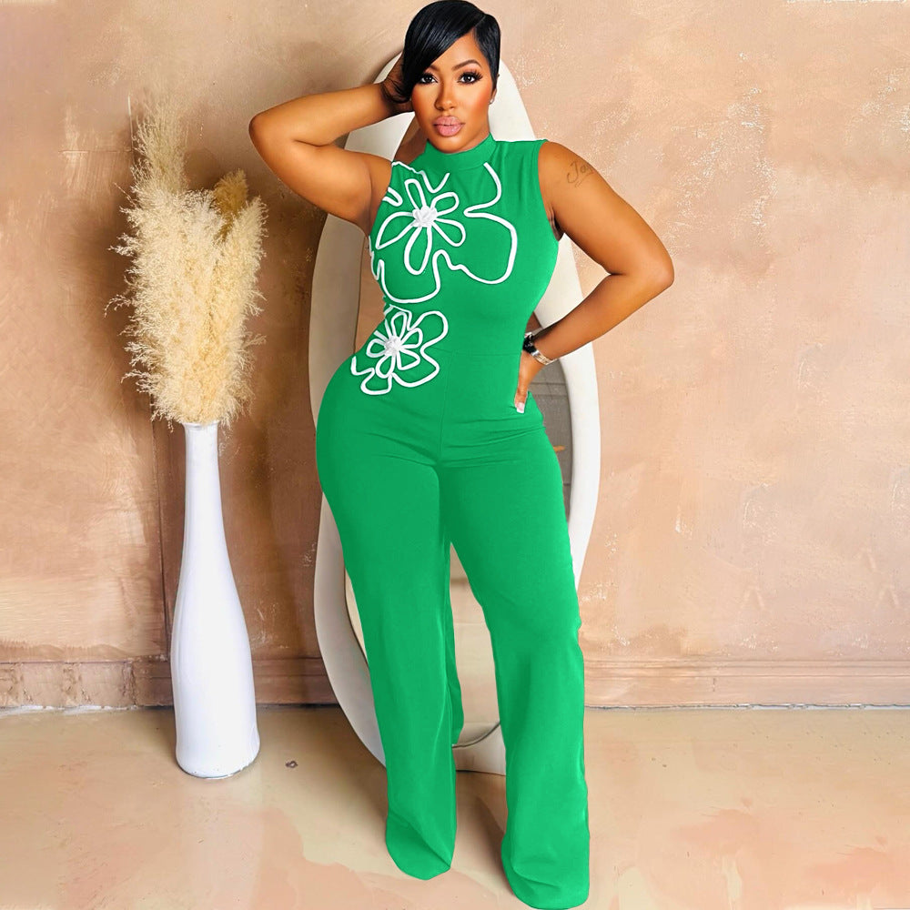 Green sleeveless one-piece with round neck and floral print, slim wide-leg trousers