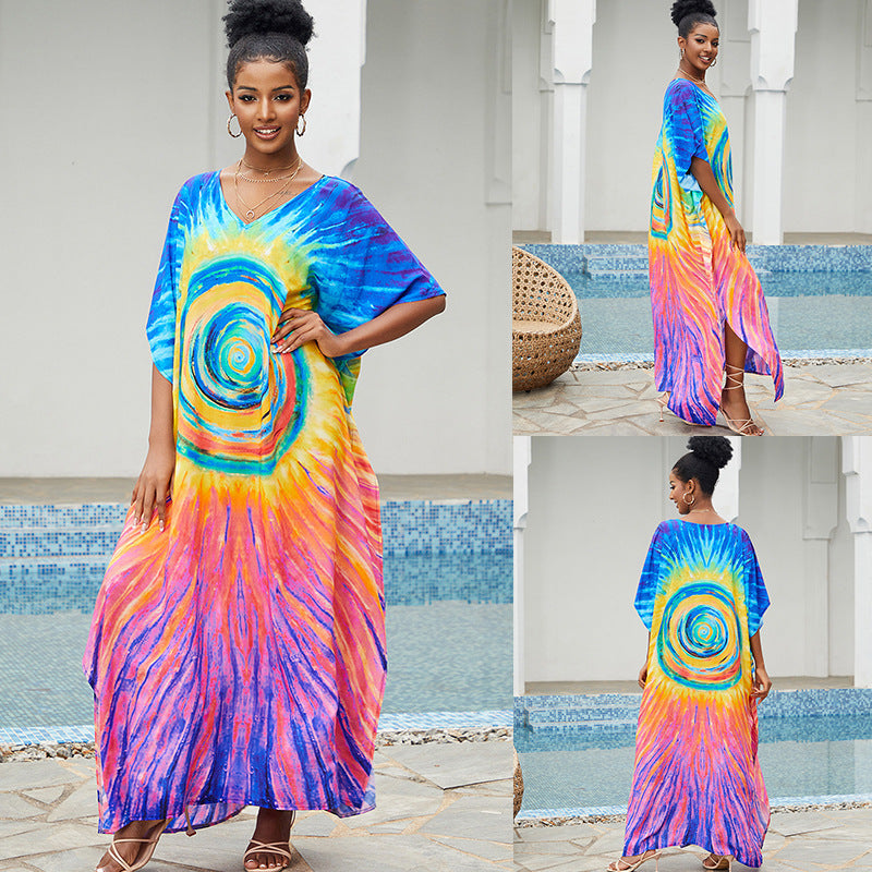 Bright spiral tie-dye maxi cover-up dress with V-neck and loose, flowing skirt