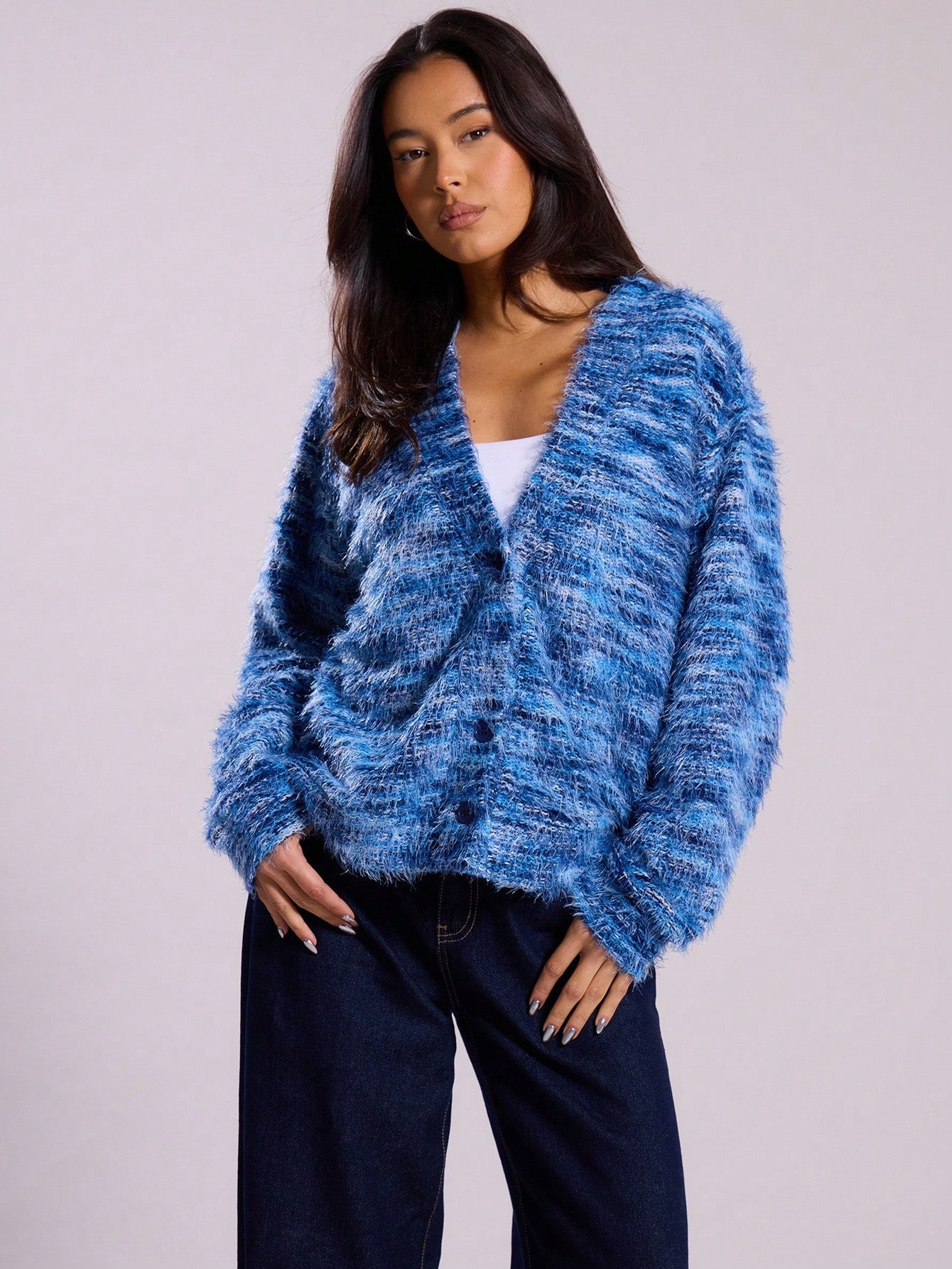 Blue marled plush cardigan with deep V plunge, long sleeves, striped knit detail.