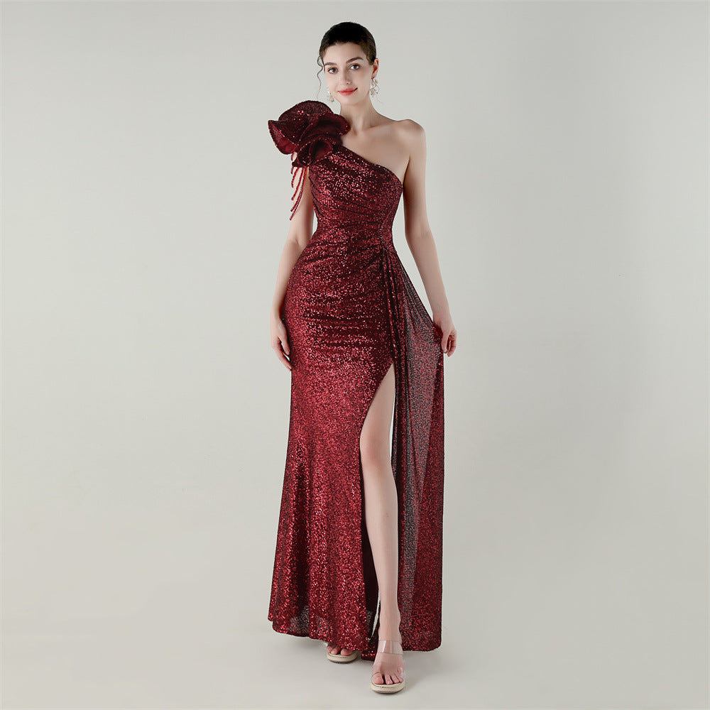 Burgundy one-shoulder beaded evening dress with diagonal neckline and side slit fishtail hem