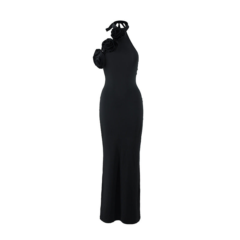 Black halter backless gown with raised floral rosette detail and side slit