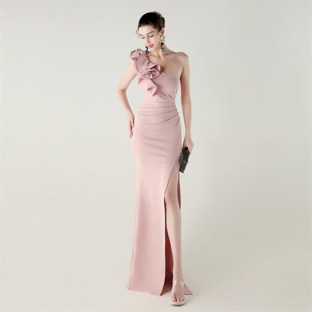 Blush pink one-shoulder satin evening dress with ruffled shoulder detail and high slit